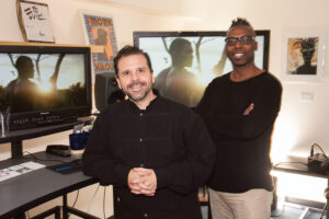 <em>Agustin “Auggie” Reach, assistant editor, left, and James Wilcox, editor,</em> Night Two.