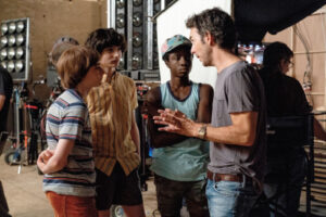 Noah Schnapp, Finn Wolfhard, Caleb McLaughlin, Shawn Levy on the “Stanger Things” set.