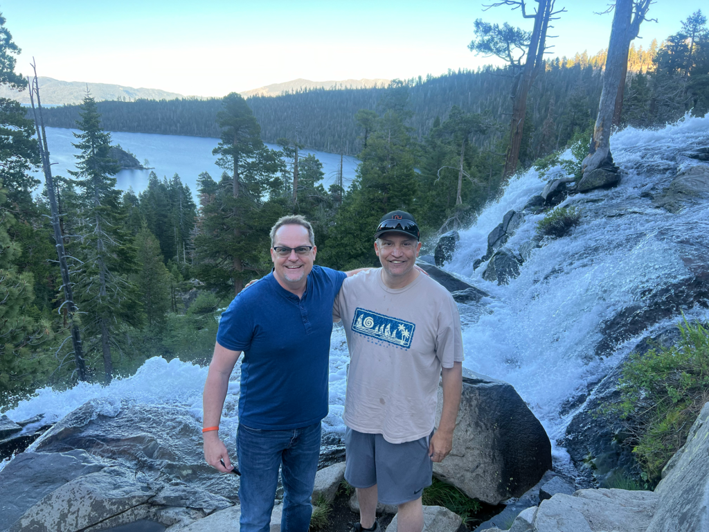 Erik C. Andersen, left, and Frank Delgado take a hike to the waterfall. Photo by A.J. Catoline