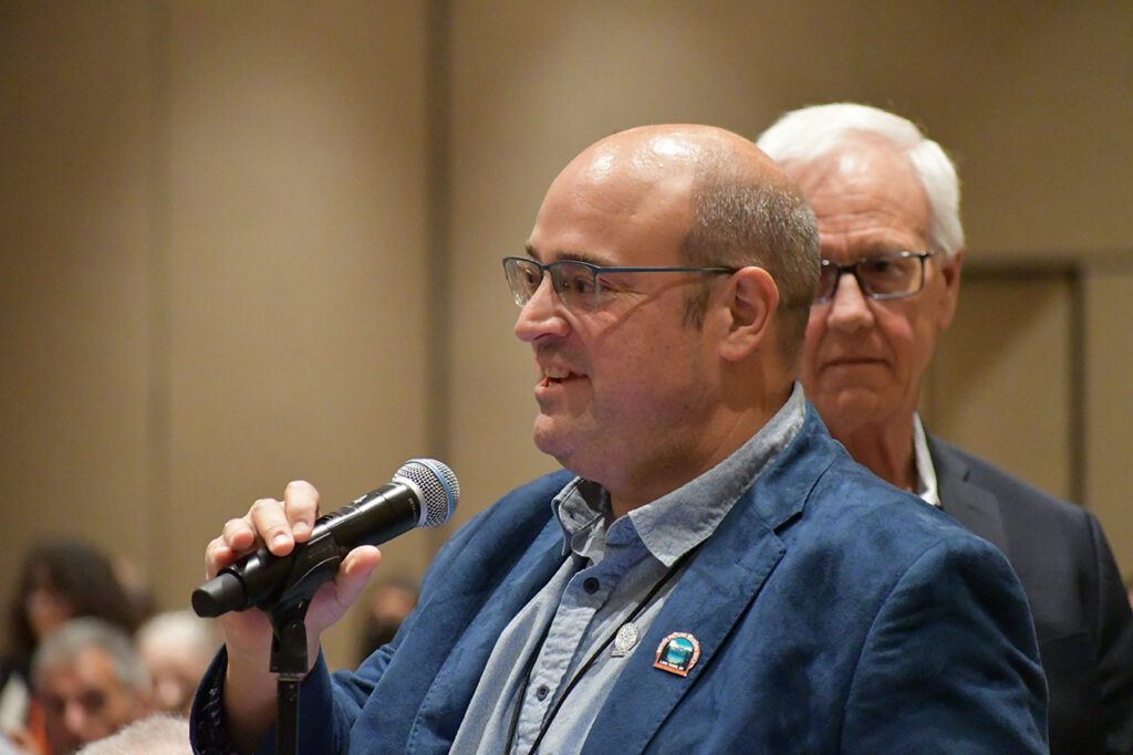 Delegate A.J. Catoline speaks in favor of Local 700 Get Out The Vote resolution. Photo by F. Hudson Miller.